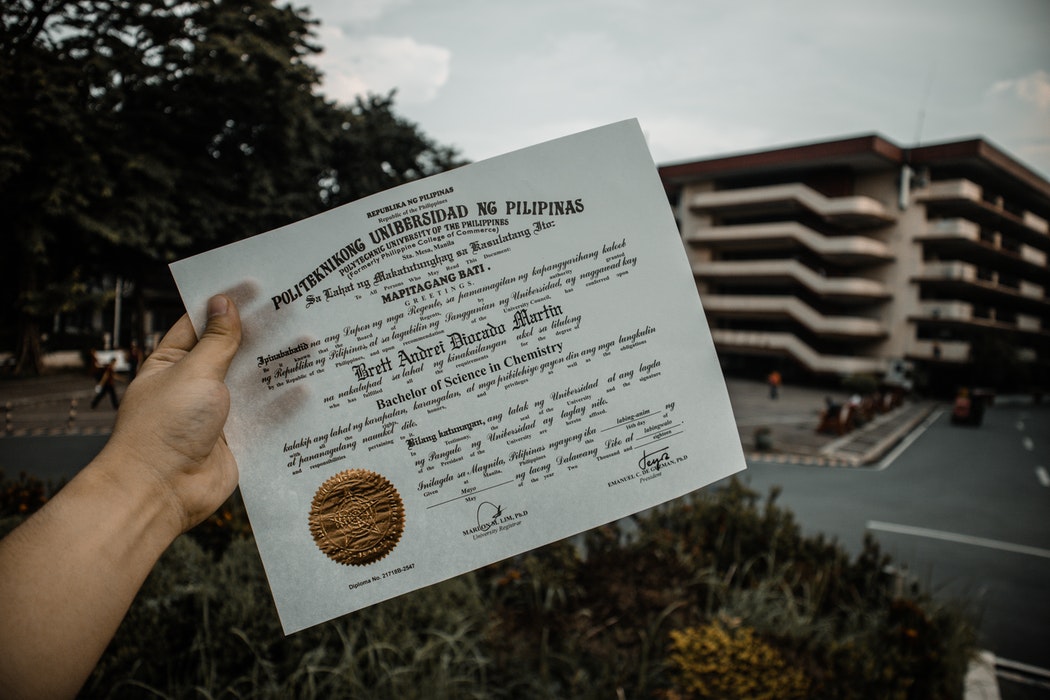 person holding a diploma